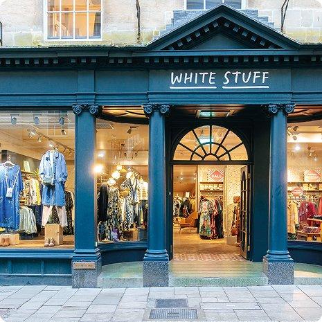 a store front with a sign that says white stuff